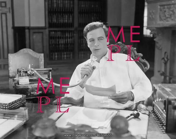 : Man reading into Dictaphone : Man reading into Dictaphone