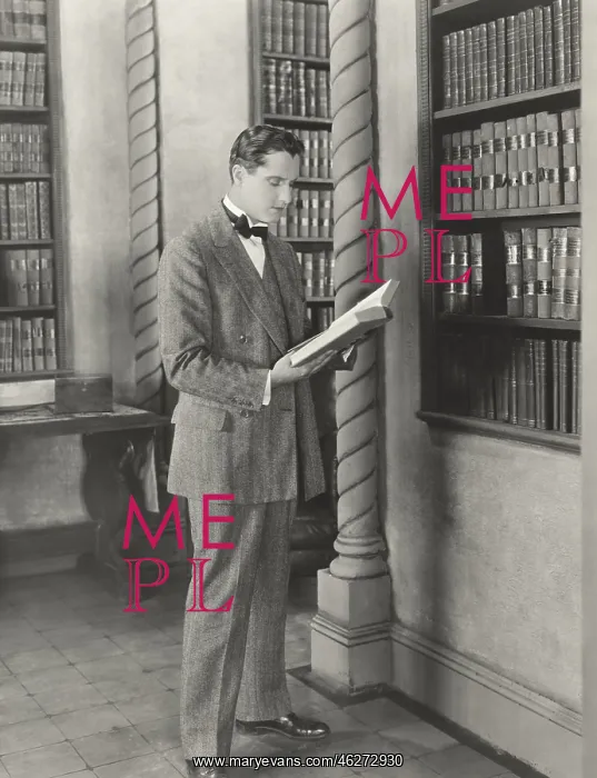 : Man reading library book : Man reading library book