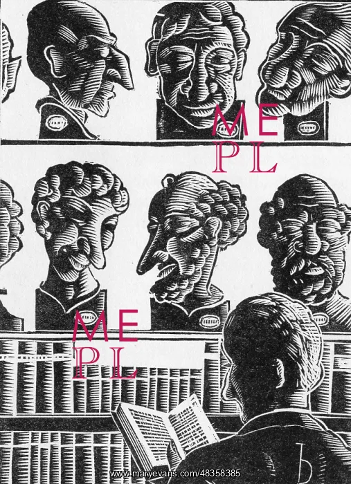 : A man reads a book in a shop : A man reads a book in a shop