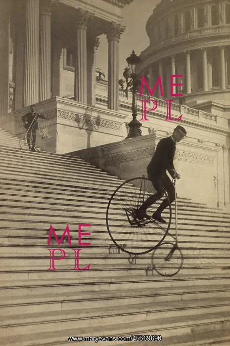 : Man riding a penny-farthing bicycle down the : Man riding a penny-farthing bicycle down the