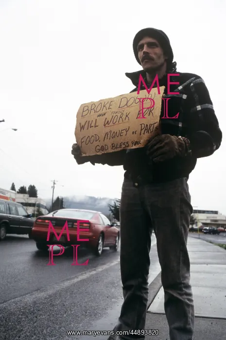 : Man On Roadside Holding Sign Requesting Work : Man On Roadside Holding Sign Requesting Work