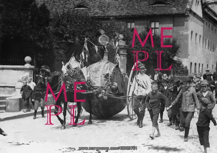 : Man rolls an advertisement ball through Germany, 1913 : Man rolls an advertisement ball through Germany, 1913