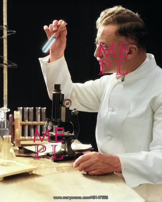 : Man Scientist Lab Technician in White Coat Looking : Man Scientist Lab Technician in White Coat Looking