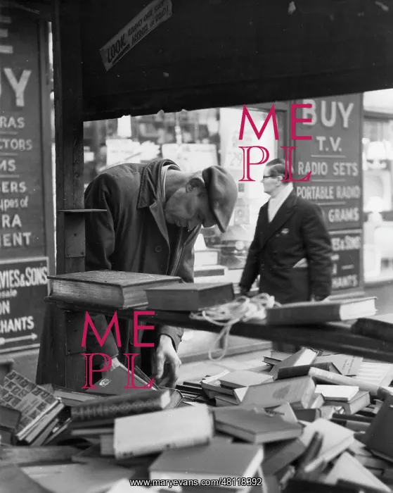 : Man at a secondhand book stall : Man at a secondhand book stall