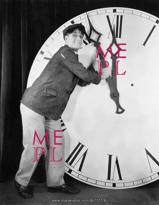  : Man setting time on a big clock