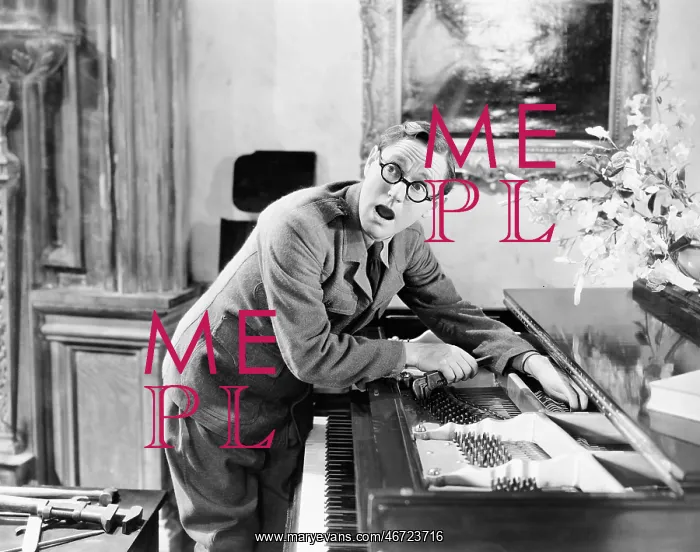 : Man shouting with his hand caught in a piano : Man shouting with his hand caught in a piano