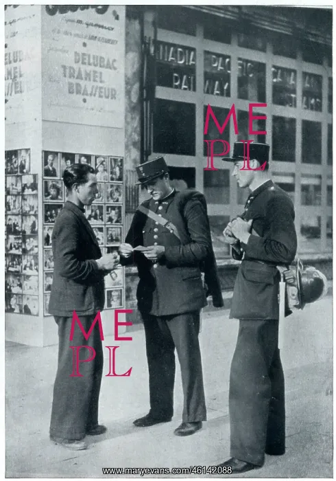 : Man shows identity papers to gendarmes, September 1939 : Man shows identity papers to gendarmes, September 1939