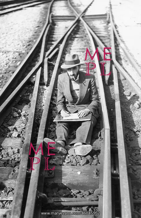 : A Man sits on the railway tracks : A Man sits on the railway tracks