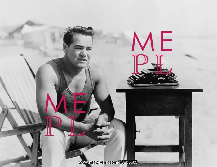 : Man sitting at the beach with his typewriter : Man sitting at the beach with his typewriter