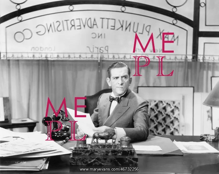 : Man sitting at his desk in the office : Man sitting at his desk in the office