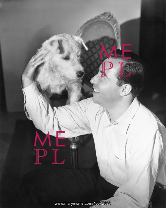  : Man sitting on the floor petting his dog