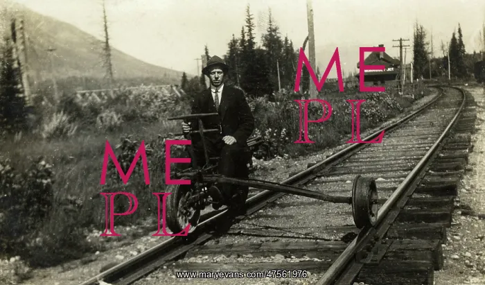 : A man sitting on part of a modified railway suspension : A man sitting on part of a modified railway suspension