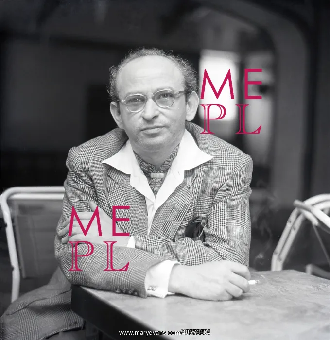 : Man sitting at a table : Man sitting at a table