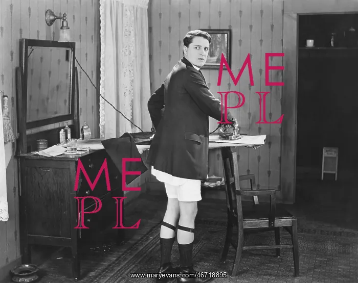 : Man in sock garters ironing : Man in sock garters ironing