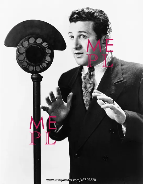  : Man speaking into a microphone