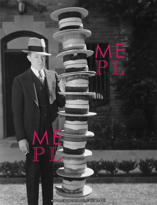: Man with a stack of hats : Man with a stack of hats