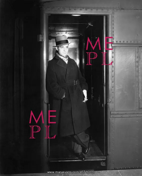 : Man standing in the doorway of a train waiting : Man standing in the doorway of a train waiting