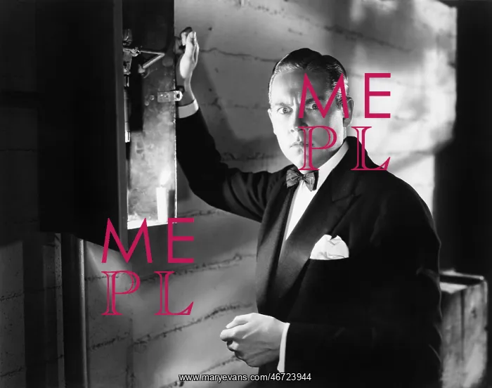 : Man standing in front of a fuse box looking frightened : Man standing in front of a fuse box looking frightened