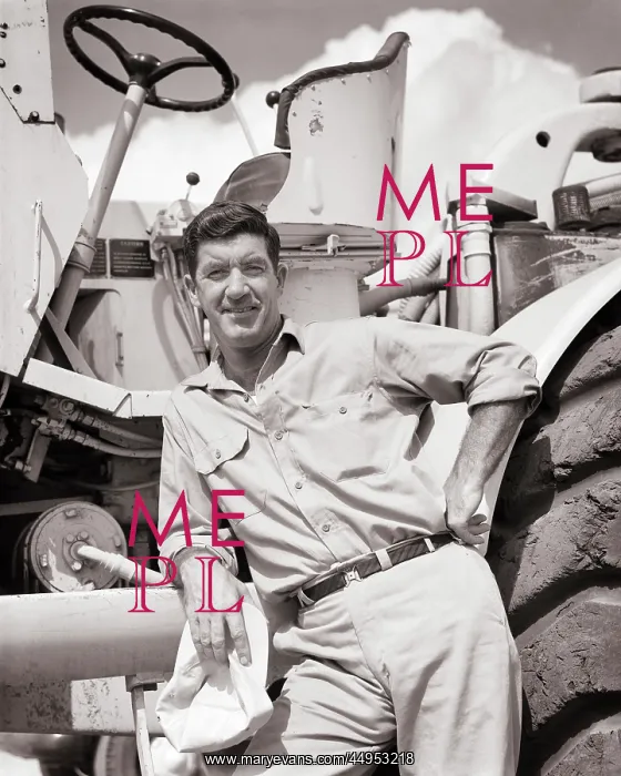: Man Standing Beside Large Piece Heavy Construction : Man Standing Beside Large Piece Heavy Construction