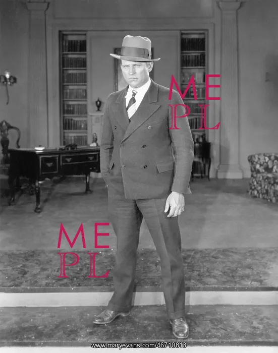 : Man standing in an office : Man standing in an office