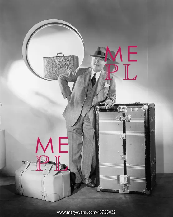  : Man standing and waiting with his luggage