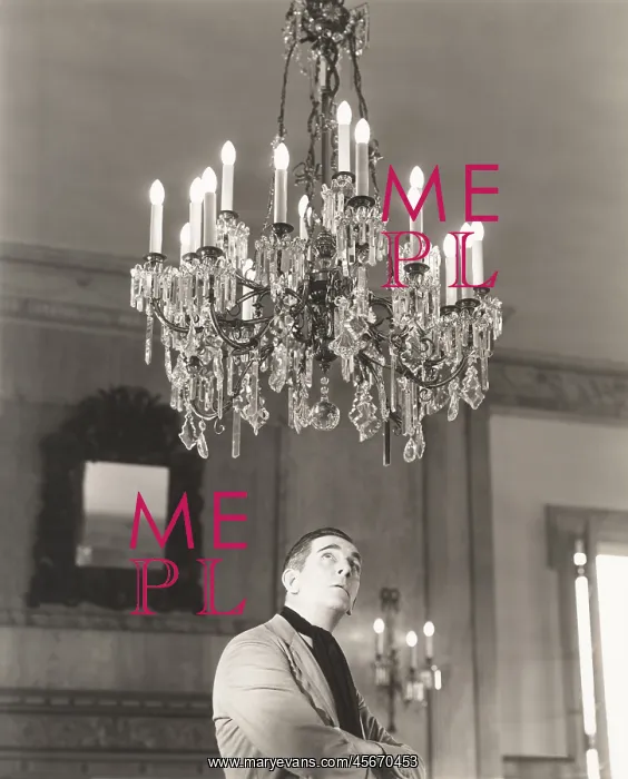 : Man staring at chandelier : Man staring at chandelier