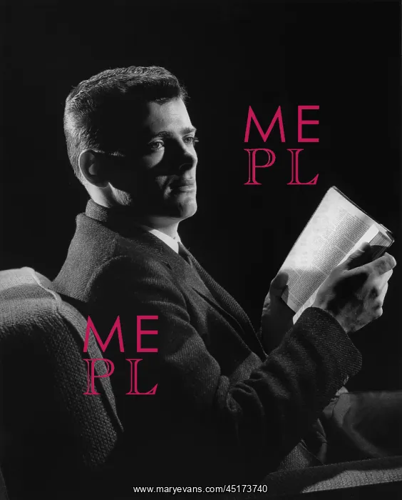 : Man in suit sitting in dim light reading a book : Man in suit sitting in dim light reading a book