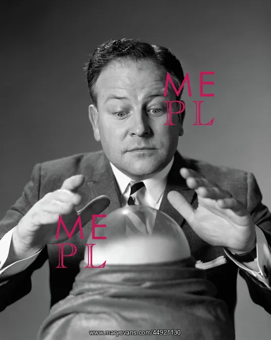 : Man in suit & tie looking down at crystal ball : Man in suit & tie looking down at crystal ball