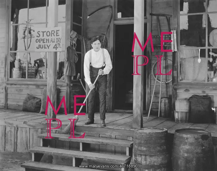 : Man sweeping steps in front of store : Man sweeping steps in front of store