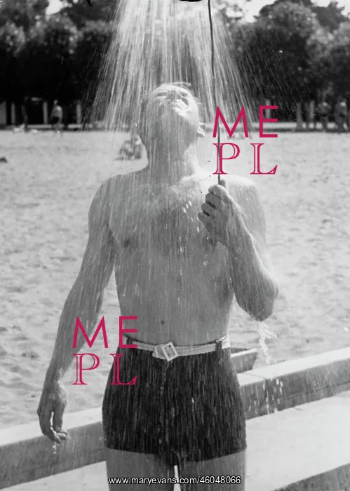  : Man taking shower on beach