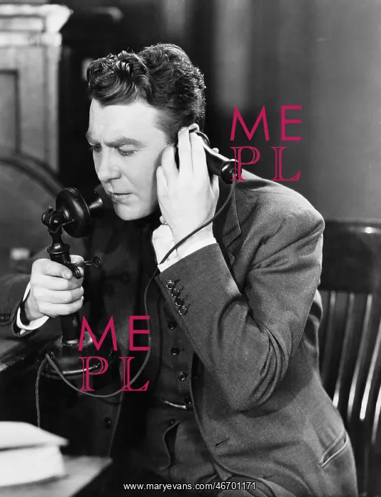 : Man talking on telephone : Man talking on telephone