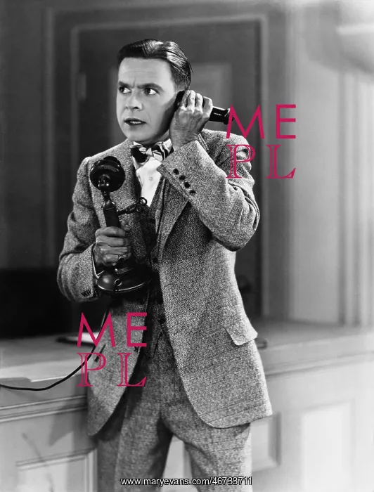 : Man talking on the telephone looking stressed : Man talking on the telephone looking stressed