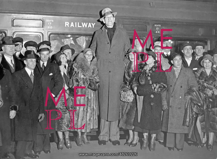 : A man of tall stature in front of the subway, circa 1920s : A man of tall stature in front of the subway, circa 1920s