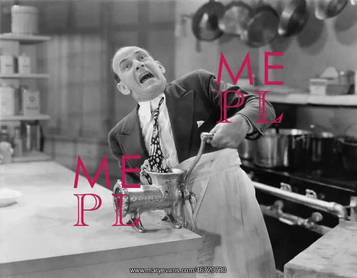 : Man with tie stuck in meat grinder : Man with tie stuck in meat grinder