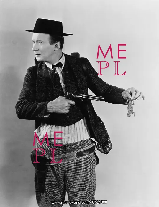 : Man trying to shoot a lizard with a handgun : Man trying to shoot a lizard with a handgun