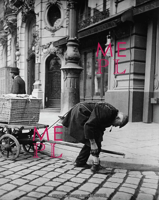 : Man tugging a cart in front of the : Man tugging a cart in front of the
