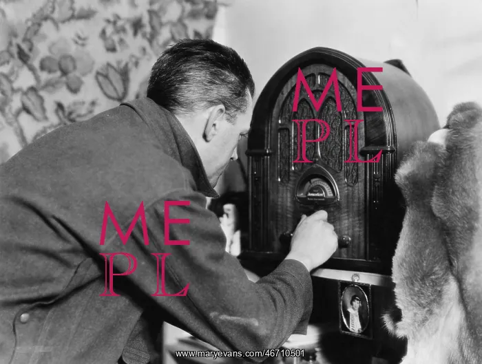  : Man tuning the radio