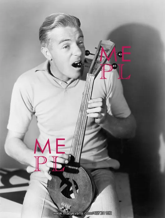 : Man tuning a Turkish spike fiddle : Man tuning a Turkish spike fiddle