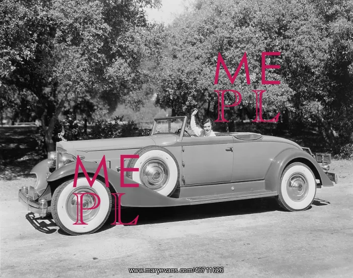 : Man waving goodbye from a car : Man waving goodbye from a car
