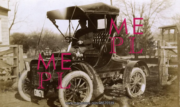 : Man at the wheel of an early car, USA : Man at the wheel of an early car, USA