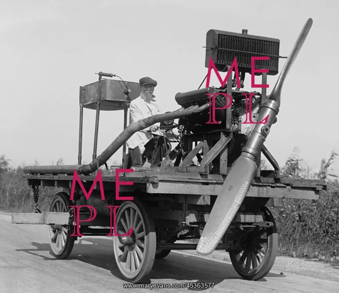 : Man on wheeled vehicle with mounted propeller, in : Man on wheeled vehicle with mounted propeller, in