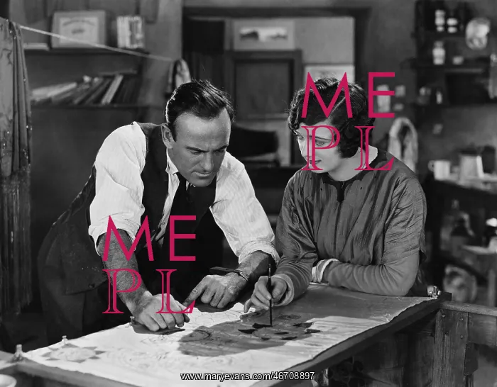 : Man and woman collaborating on illustration : Man and woman collaborating on illustration