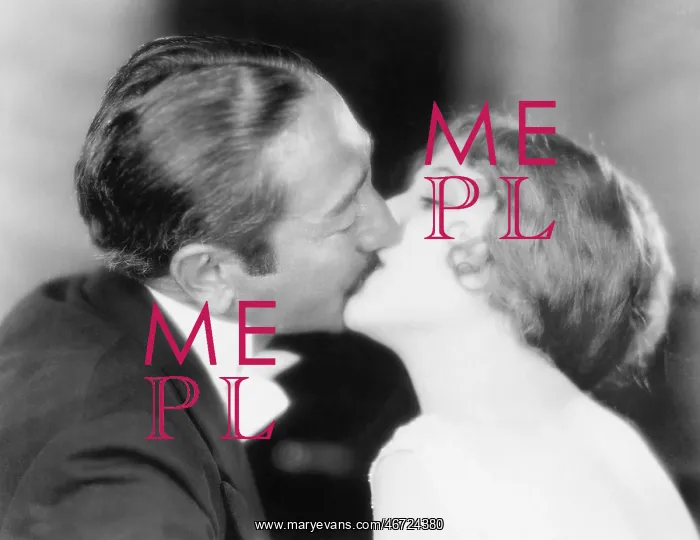 : Man and woman kissing each other : Man and woman kissing each other
