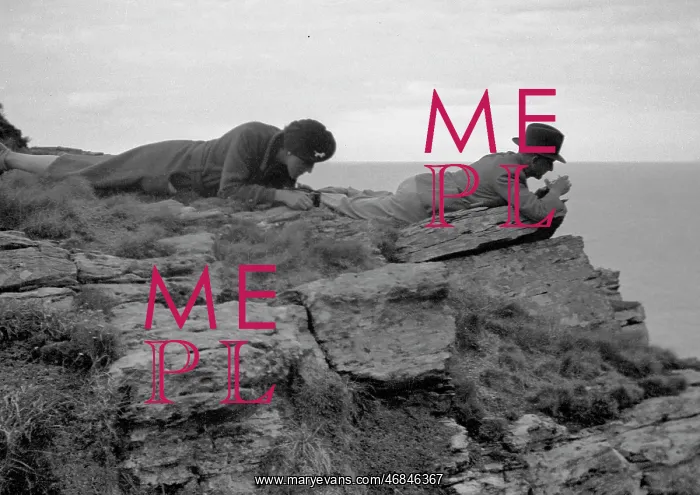 : Man and woman lying on a rock : Man and woman lying on a rock