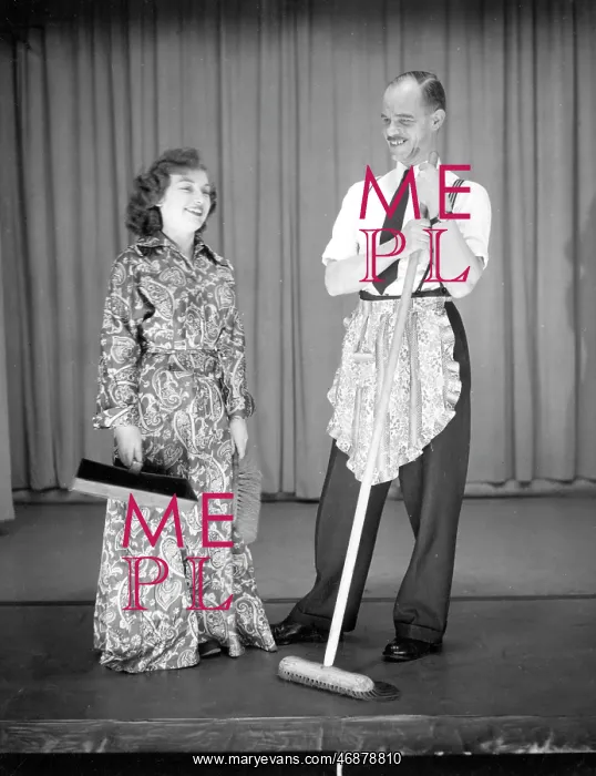 : Man and woman performing a comic sketch : Man and woman performing a comic sketch