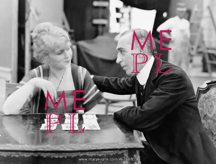 : Man with woman playing card game : Man with woman playing card game