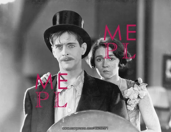 : Man and woman standing together looking sad : Man and woman standing together looking sad