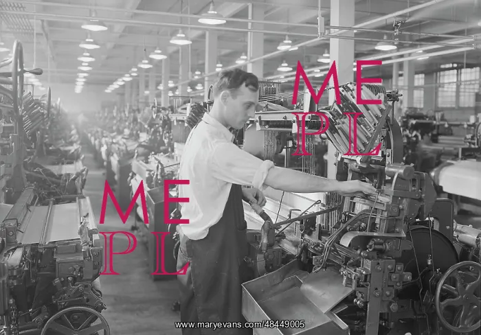 : Man working an automatic loom, 1936 : Man working an automatic loom, 1936