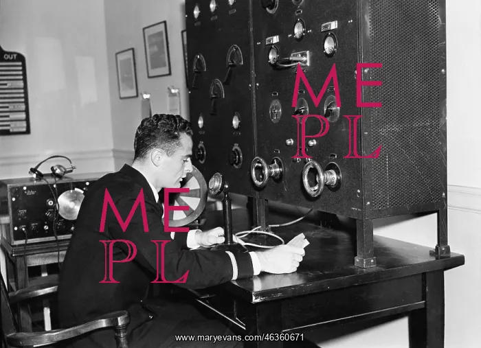: Man working on a radio : Man working on a radio