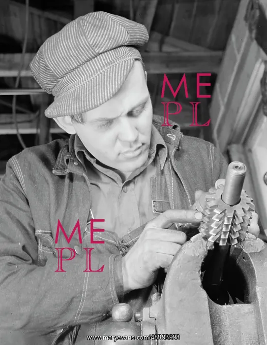 : Man working in a small machine shop for war : Man working in a small machine shop for war